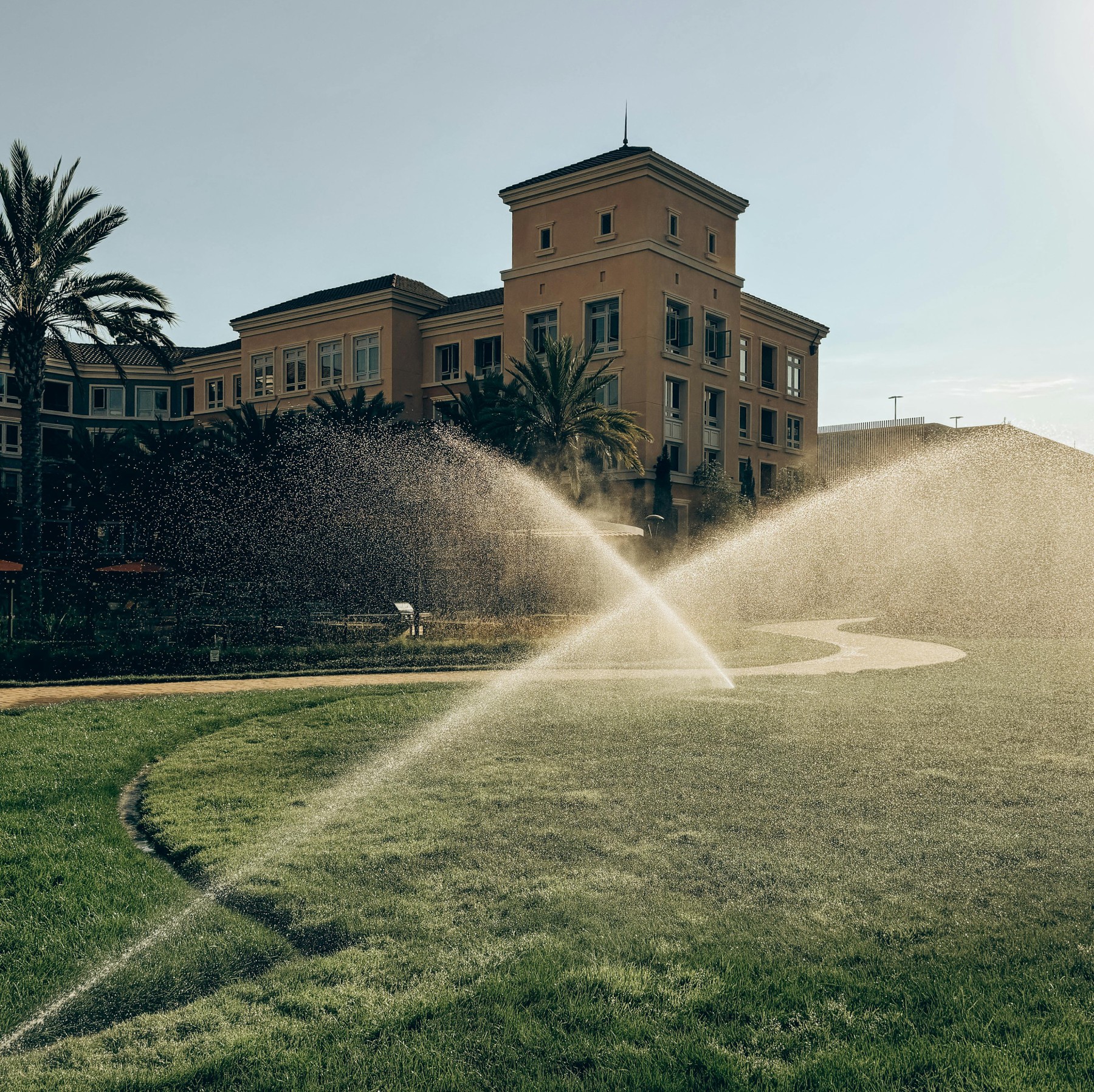 Photo by Anna Arysheva: https://www.pexels.com/photo/sprinklers-watering-lawn-at-palace-27443421/